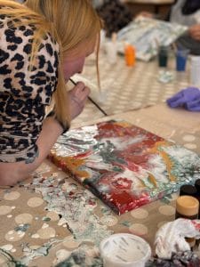 Blowing paint on canvas